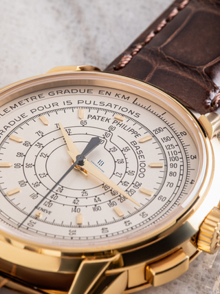 Elegant Patek Philippe watch featuring a classic design with a white dial and leather strap.