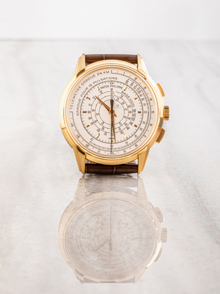 Elegant Patek Philippe watch featuring a white dial and rose gold accents.