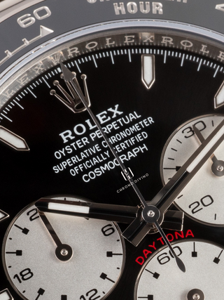 Macro shot of a Rolex Daytona 126529LN dial, highlighting the "ROLEX," "OYSTER PERPETUAL SUPERLATIVE CHRONOMETER OFFICIALLY CERTIFIED"