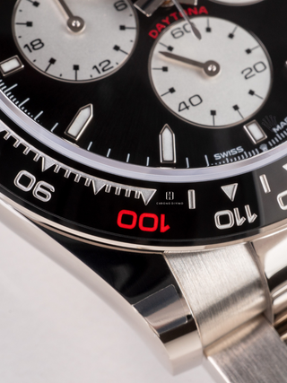 Extream close-up of the Rolex Daytona dial, showcasing the intricate details of the watchmaking, including the precise printing of the text