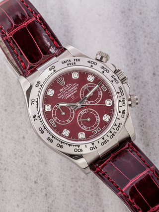 Rolex Daytona 116519 with burgundy dial, diamond markers, tachymeter bezel and full dial text