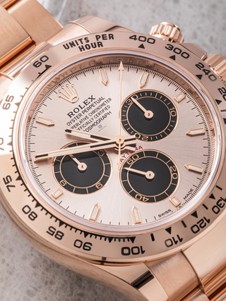 Close-up of the dial of a Rolex Daytona 126505, highlighting the tachymeter scale on the bezel, the contrasting black subdials, the Rolex coronet logo