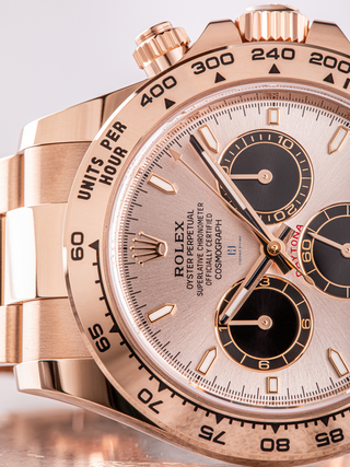 Detailed view of a Rolex Daytona 126505, showcasing the rose gold case and bracelet, the black subdials with rose gold outlines