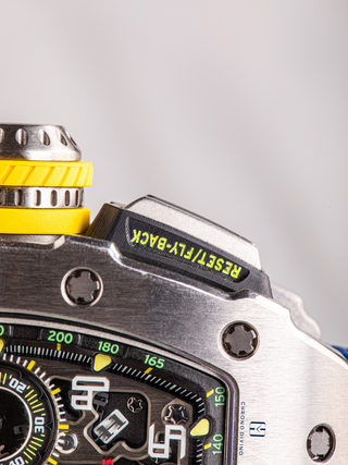 The reset/fly-back button with half of the crown is visible from Richard Mille RM11-03Ti