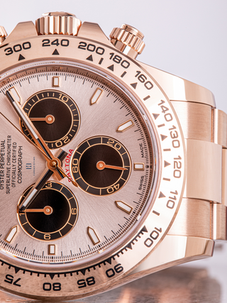 Rolex Daytona 126505 on a surface featuring dial details, complications, and tachymeter scale
