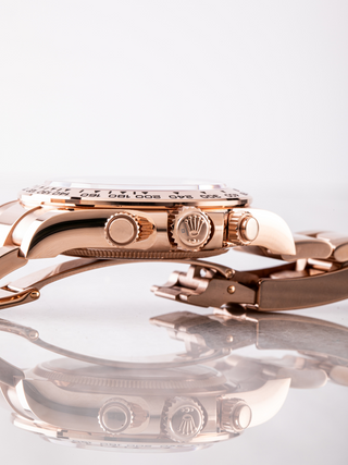Rolex coronet logo, crown, and chronograph pushers of Rolex Daytona 126505