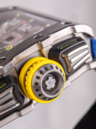 This picture shows the crown of Richard Mille RM11-03Ti with the Chrono Divino logo in it