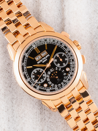 Patek Philippe 5270/1R of golden hue displayed diagonally