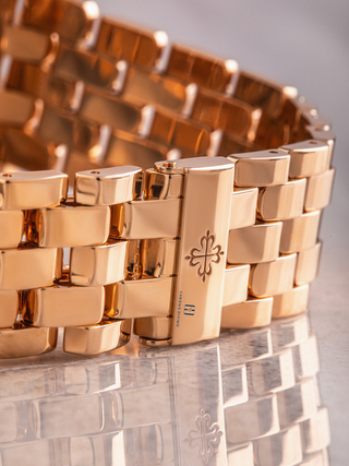 The clasp of Patek Philippe 5270/1R reflecting upon a marble floor