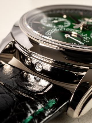 The image focuses on the radiance of platinum in the timeless design of the case