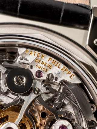 The embossment of Patek Philippe Geneve Swiss with Chrono Divino logo in the back of Patek Philippe 5270P is highlighted