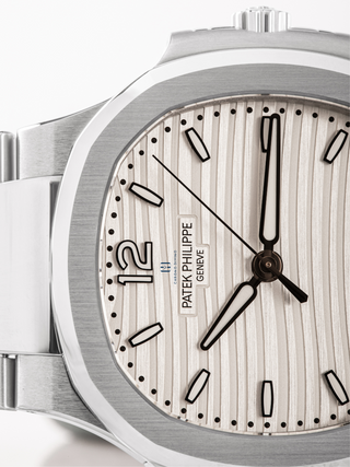 The semi-visible dial of Patek Philippe 7118/1A with moonphase indicator and a date display(upper section)