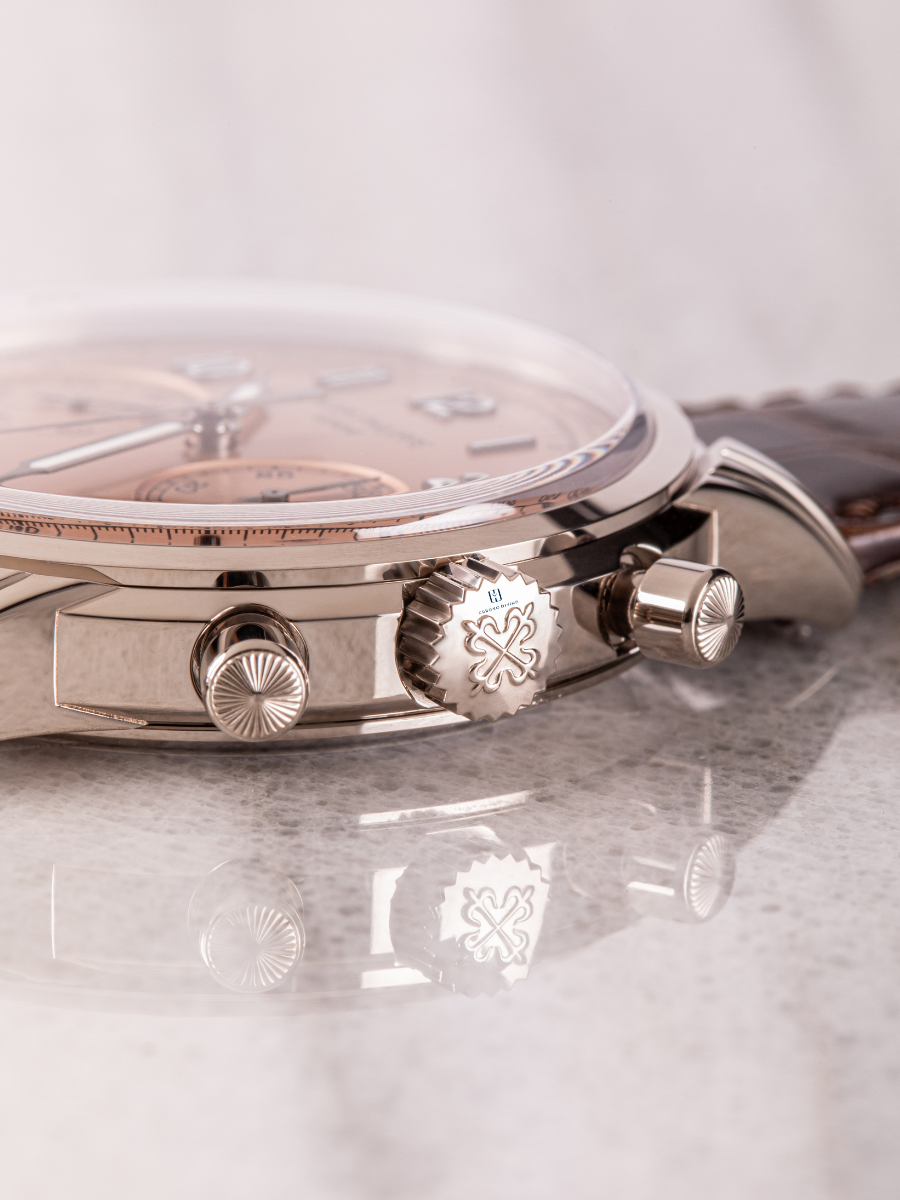 Detailed view of Patek Philippe 5172G dial showcasing a rose gold crown, and pusher design elements