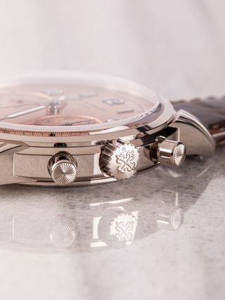 Detailed view of Patek Philippe 5172G dial showcasing a rose gold crown, and pusher design elements