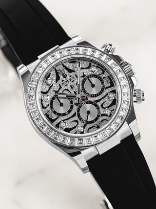 Rolex Daytona 116589TBR with a lavish diamond setting on the bezel and dial, complemented by a black rubber strap