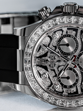Close-up of Rolex Daytona 116589TBR with diamond bezel, subdials, and ""ROLEX"" text