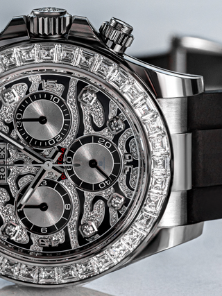 Detailed view of a Rolex Daytona with the unique pattern of the pave diamond dial, the three subdials with diamond outlines