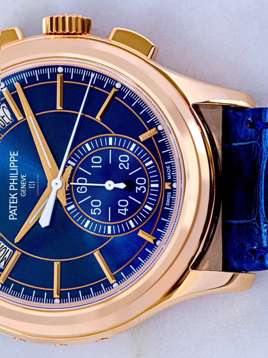 The image is on the right side view of Patek Philippe watch’s  blue belt and the portion of the blue dial