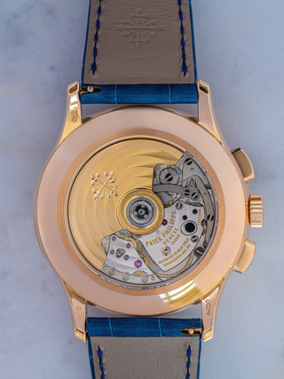 Patek Philippe Geneve watch is in the picture, showing its feature of adjusting to heat cold isochronism
