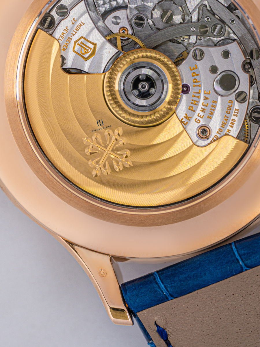 The zoomed-in view of Patek Philippe Geneve watch dial with silver and golden halves
