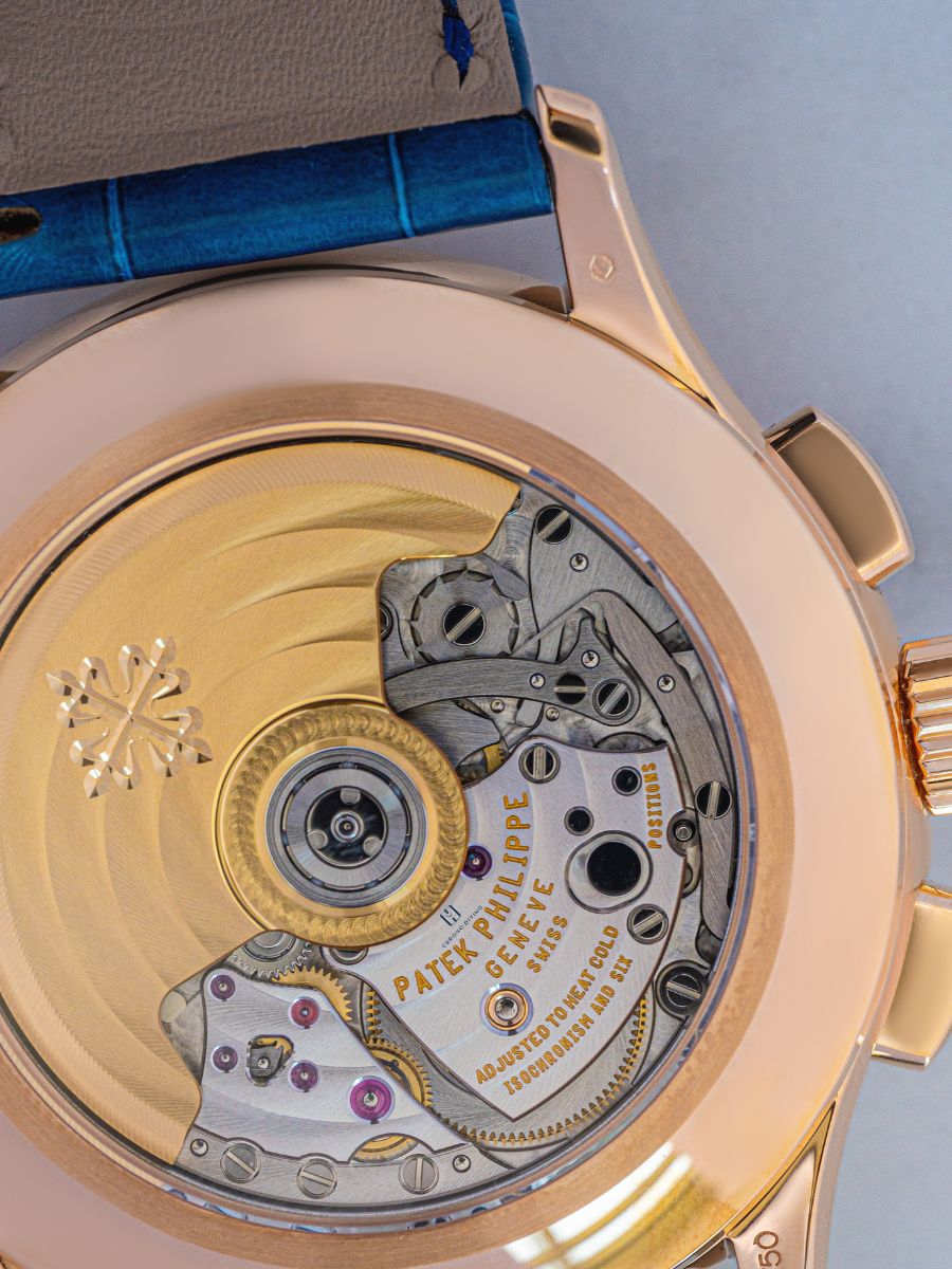 The enlarged view of Patek Philippe Geneve watch with blue strap has been shown in the picture