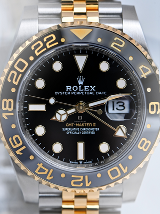 Close-up view of Rolex GMT Master II 126713GRNR with black dial