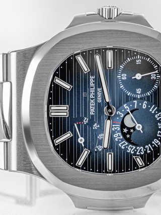 The dark blue dial of Patek Philippe 5712/1A placed horizontally