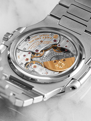 Patek Philippe 5712/1A revealing the mechanical movement with intricate gears
