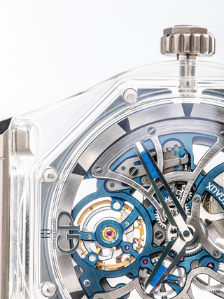 The crown and semi-visible dial with the transparent bezel of Girard-Perregaux Laureato