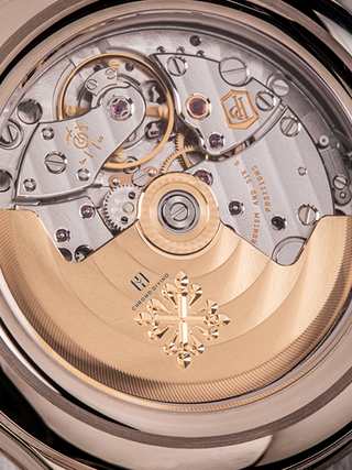 The picture is the enlarged view of Patek Philippe 5205G watch dial with a silver and golden colour combination