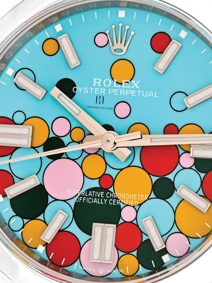 Close-up of a Rolex Oyster Perpetual dial emphasizing the colorful bubbles design and stick hour markers