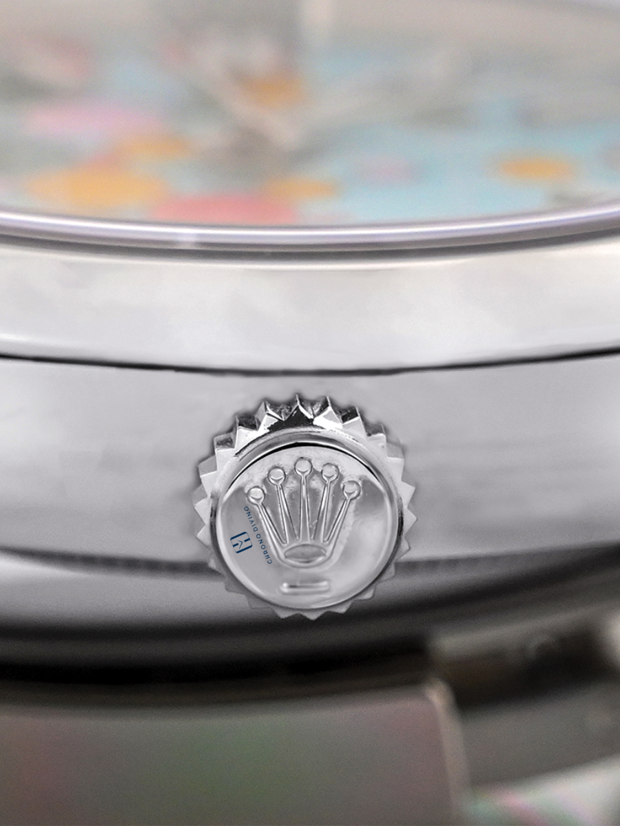 Detailed view of a Rolex crown with branding, fluting, and watchmaking precision