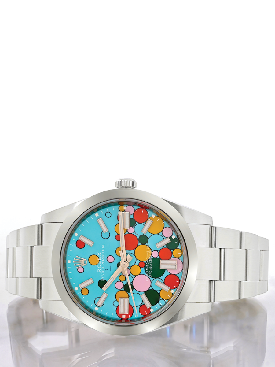 Front view of a Rolex Oyster Perpetual dial, showcasing the stainless steel case and bracelet, the light blue dial with the colorful bubbles