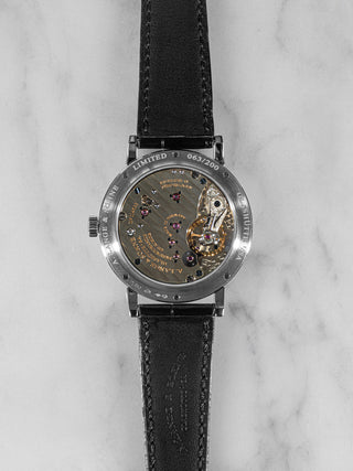 Classic A. Lange & Söhne 1815 “F. A. Lange” anniversary watch featuring polished case, black lacquer dial, and black alligator strap.