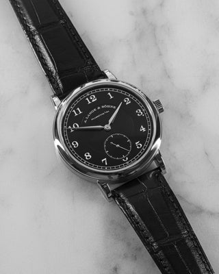 Luxury timepiece from A. Lange & Söhne – 1815 Anniversary model in platinum with clean black dial and small seconds register at 6 o’clock.
