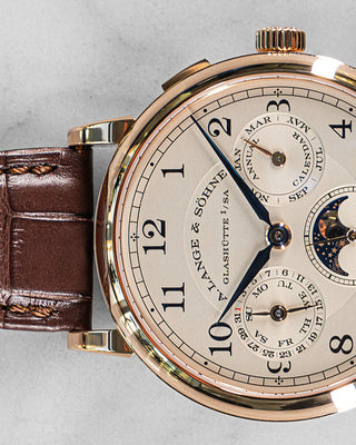 Classic A. Lange & Söhne annual calendar watch in white gold, featuring a clean silver dial, Roman numerals, and traditional complications.