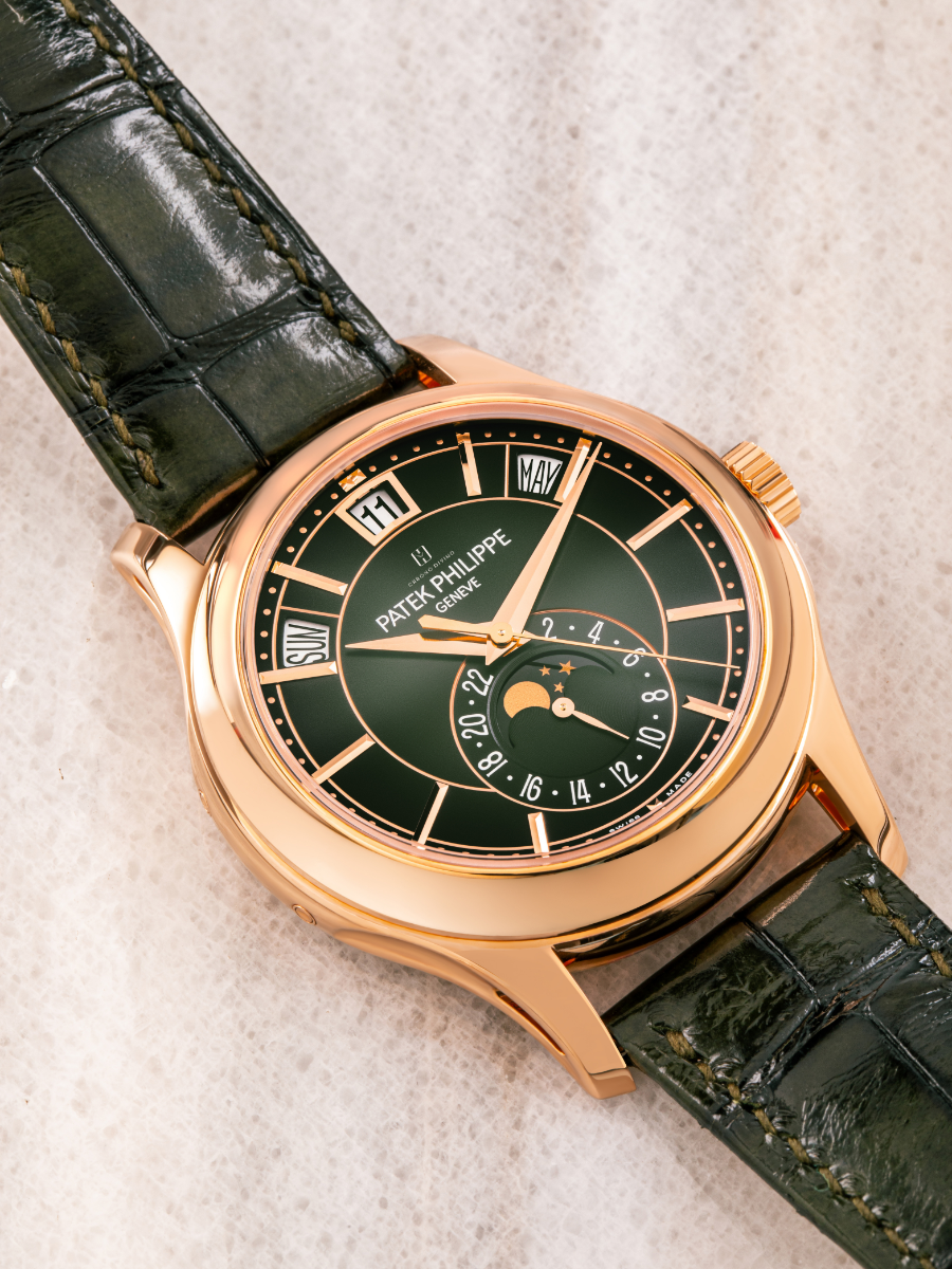 Elegant Patek Philippe watch featuring a sophisticated white dial and luxurious gold case.