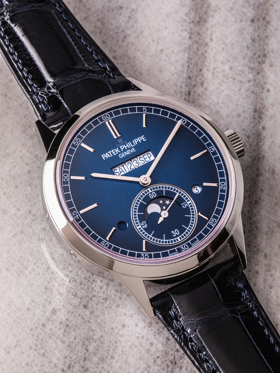 Patek Philippe 5236P-001 with blue satin-finished dial, in-line calendar display, platinum case, and alligator strap