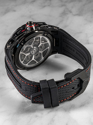 Close-up of Roger Dubuis Excalibur Spider Chronograph Flyback in lightweight titanium with visible movement and red chronograph pushers.